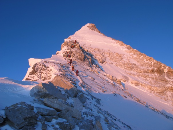 Sun rising over the 3rd step and the summit pyramid of Everest North East Ridge
