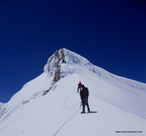 Robert Mills and Grant Rawlinson heading up the crater rim towards the summit of Tahurangi Peak, Mt Ruapehu